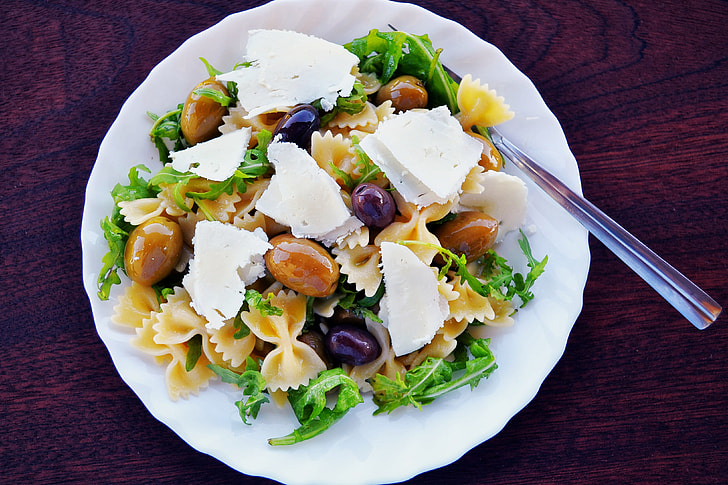 Gourmet burrata cheese atop a vibrant salad, showcasing the perfect blend of textures and colors